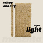 Crispy maszfita crispbread slice with text 'crispy and airy' and 'super light' on a beige background