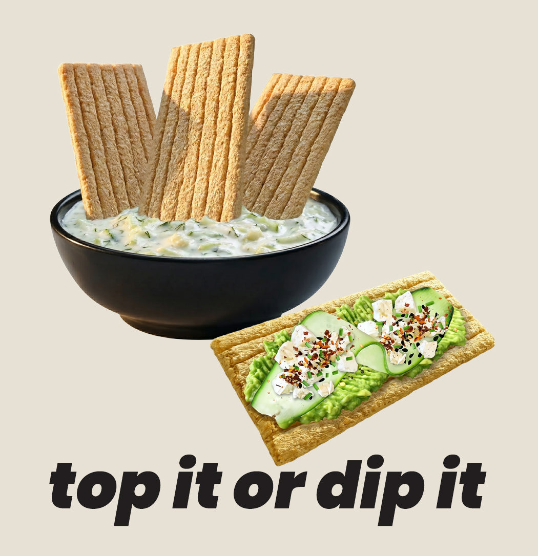 Bowl of dip with maszfita crispbreads and a crispbread with avocado spread on a beige background